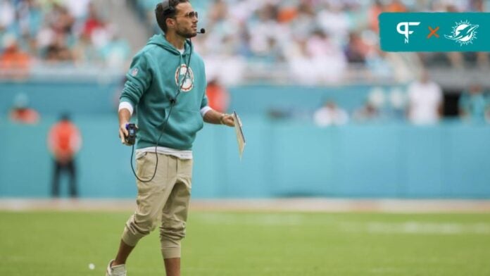 Miami Dolphins head coach Mike McDaniel on the field in the game versus the New England Patriots.