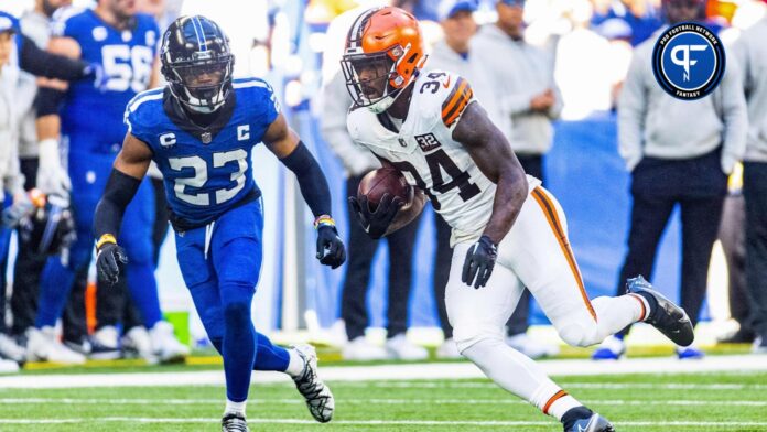 Cleveland Browns running back Jerome Ford (34) runs the ball while Indianapolis Colts cornerback Kenny Moore II (23) pursues.