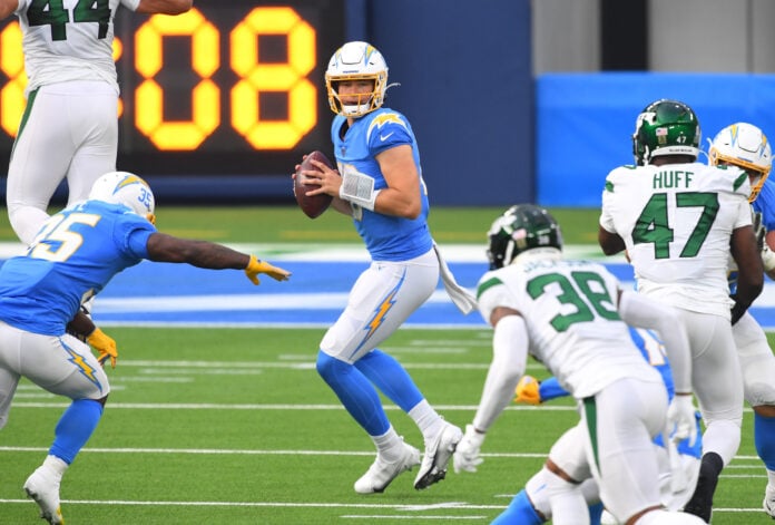 Los Angeles Chargers quarterback Justin Herbert (10) droops back to pass against the New York Jets in the first half at SoFi Stadium.