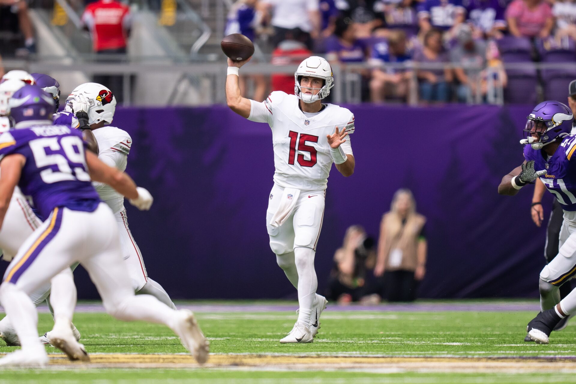 Arizona Cardinals quarterback Clayton Tune (15) throws a pass against the Minnesota Vikings in the second quarter at U.S. Bank Stadium.