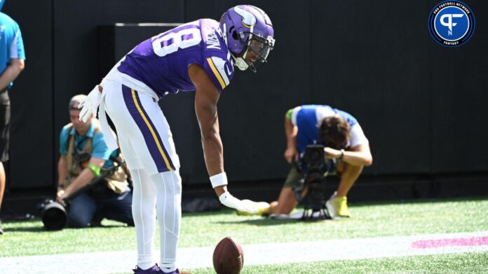 Minnesota Vikings wide receiver Justin Jefferson (18) reacts after scoring a touchdown.
