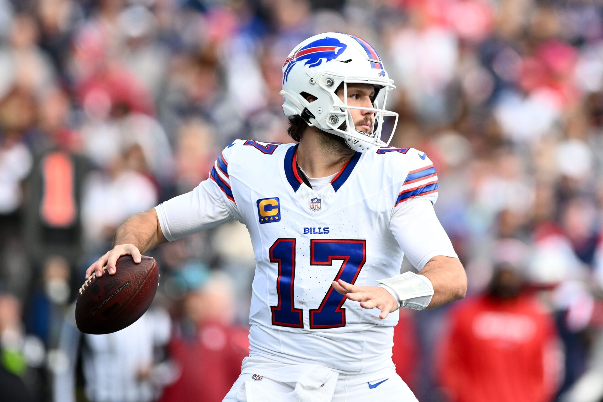 Buffalo Bills quarterback Josh Allen (17) throws against the New England Patriots during the first half at Gillette Stadium.