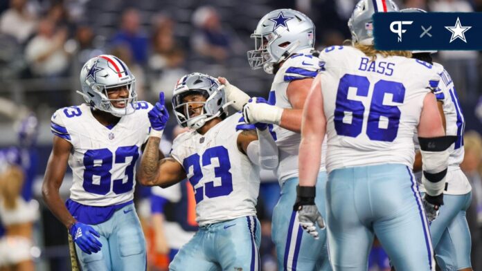 Dallas Cowboys running back Rico Dowdle (23) celebrates with teammates after a touchdown during the second half against the New York Giants at AT&T Stadium.