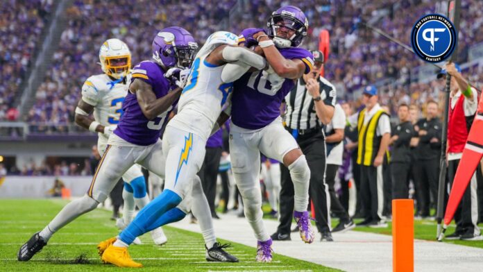 Minnesota Vikings wide receiver Justin Jefferson (18) runs after the catch against the Los Angeles Chargers in the fourth quarter at U.S. Bank Stadium.