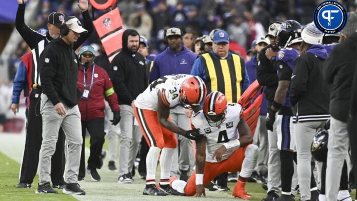 Cleveland Browns quarterback Deshaun Watson (4) is helped up by running back Jerome Ford (34) after being tackled out of bounds during the second half against the Baltimore Ravens.
