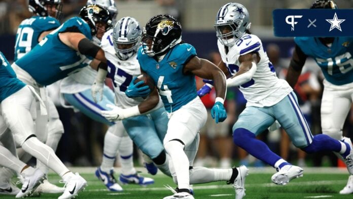 Dallas Cowboys LB Damone Clark (33) tackles Jacksonville Jaguars RB Tank Bigsby (4) from behind.