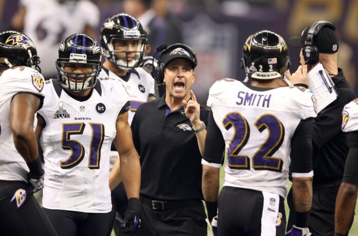 Baltimore Ravens head coach John Harbaugh speaks to team members during their game against the San Francisco 49ers in Super Bowl XLVII.