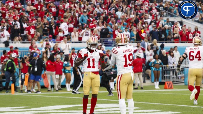 San Francisco 49ers wide receiver Brandon Aiyuk (11) and wide receiver Deebo Samuel (19) celebrate a touchdown against the Jacksonville Jaguars.