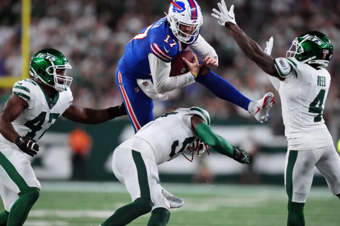 Buffalo Bills QB Josh Allen (17) attempts to hurdle against the New York Jets.
