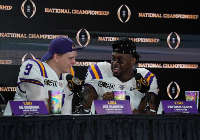 LSU Tigers quarterback Joe Burrow (9) and linebacker Patrick Queen (8) at a press conference after the College Football Playoff national championship game against the Clemson Tigers at Mercedes-Benz Superdome.