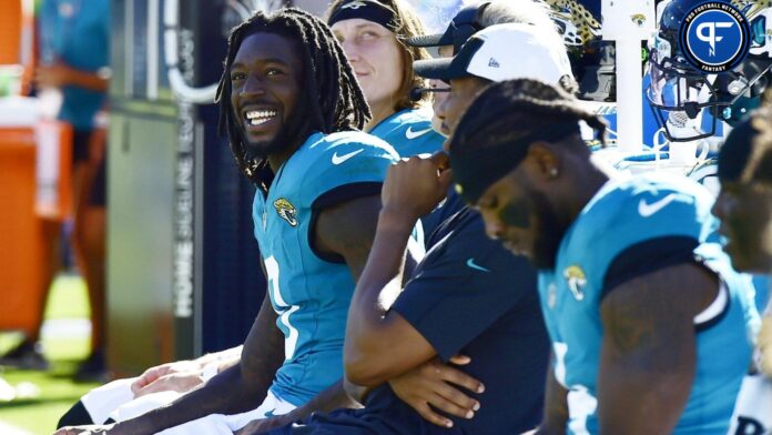 Jacksonville Jaguars wide receiver Calvin Ridley (0) sits on the bench with quarterback Trevor Lawrence (16) as the clock ticks down after the two minute warning of Sunday's game against the Indianapolis Colts