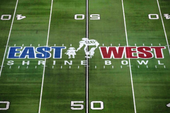 The East-West Shrine logo at midfield during the Shrine Bowl at Allegiant Stadium.