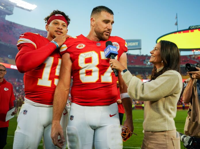 Patrick Mahomes (15) joins tight end Travis Kelce (87) as he talks with reporter Tracy Wolfson after defeating the Los Angeles Chargers at GEHA Field at Arrowhead Stadium.