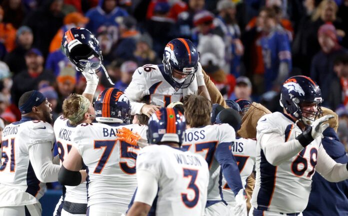 Denver Broncos place kicker Wil Lutz (16) is hoisted on his teammates shoulders after kicking the game winning field goal for a 24-22 win over the Buffalo Bills.