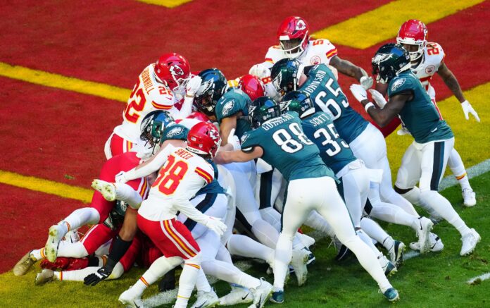 Philadelphia Eagles QB Jalen Hurts (1) scores a touchdown on a QB sneak against the Kansas City Chiefs during the first quarter in Super Bowl LVII.