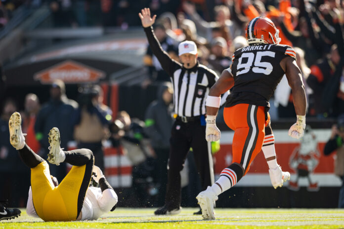 Cleveland Browns defensive end Myles Garrett (95) celebrates after sacking Pittsburgh Steelers quarterback Kenny Pickett (8) during the first quarter at Cleveland Browns Stadium.