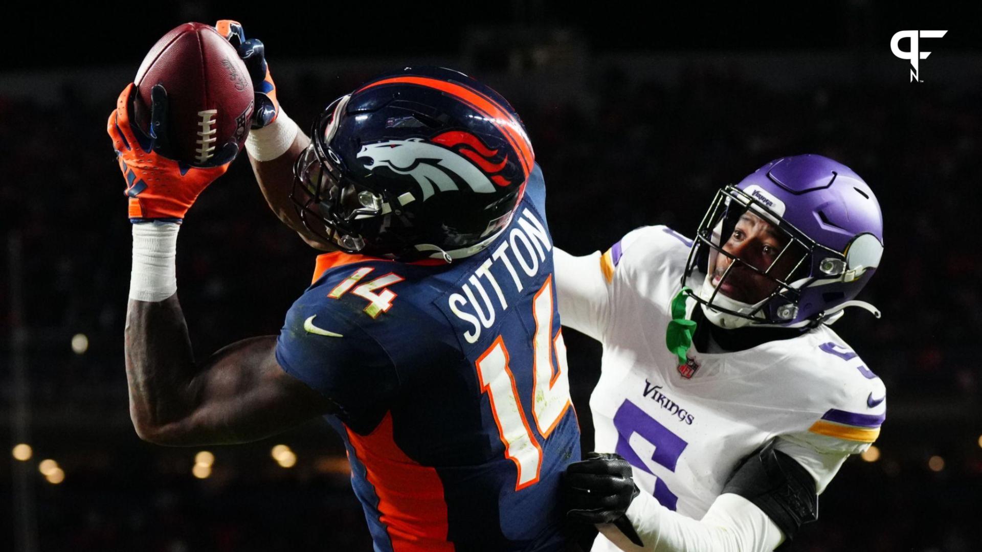 Denver Broncos wide receiver Courtland Sutton (14) catches a touchdown over Minnesota Vikings cornerback Mekhi Blackmon (5) in the fourth quarter at Empower Field at Mile High.