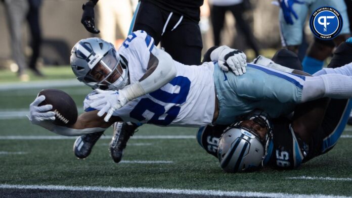 Dallas Cowboys RB Tony Pollard (20) dives into the end zone against the Carolina Panthers.
