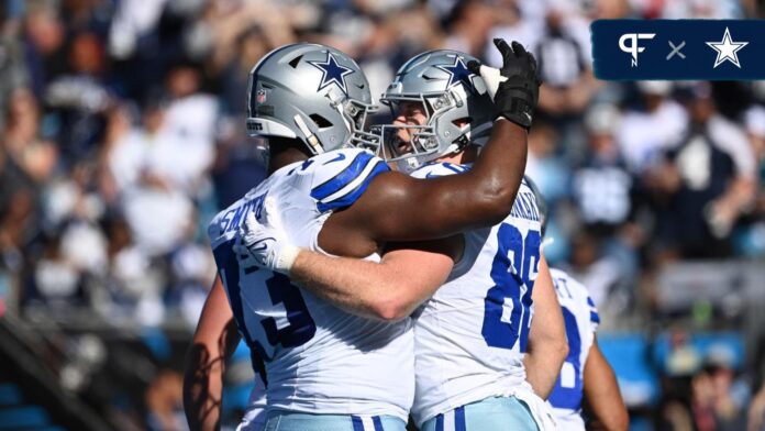 Dallas Cowboys LG Tyler Smith (73) and TE Luke Schoonmaker (86) celebrate after a touchdown.
