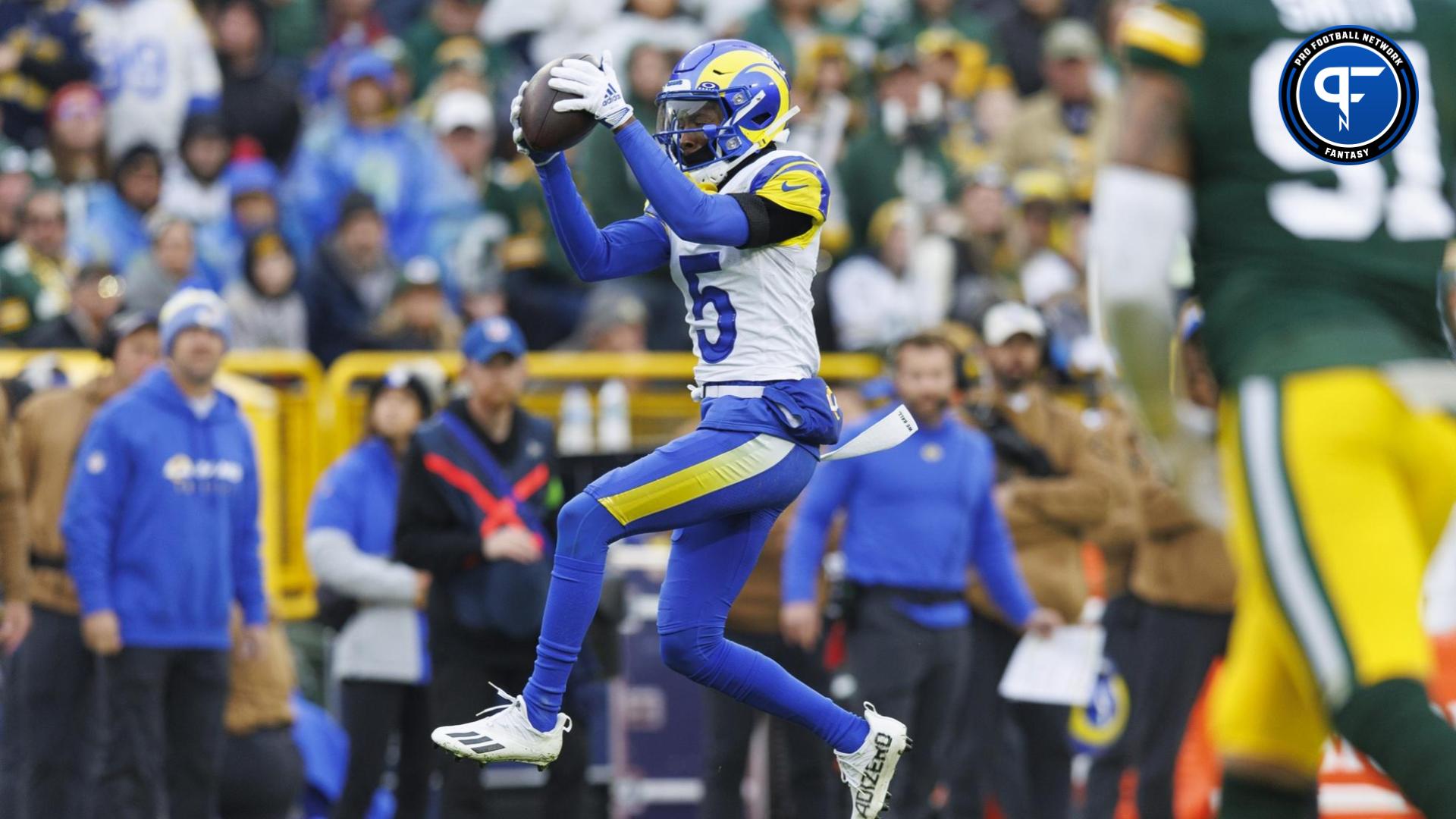 Tutu Atwell (5) catches a pass during the fourth quarter against the Green Bay Packers at Lambeau Field.