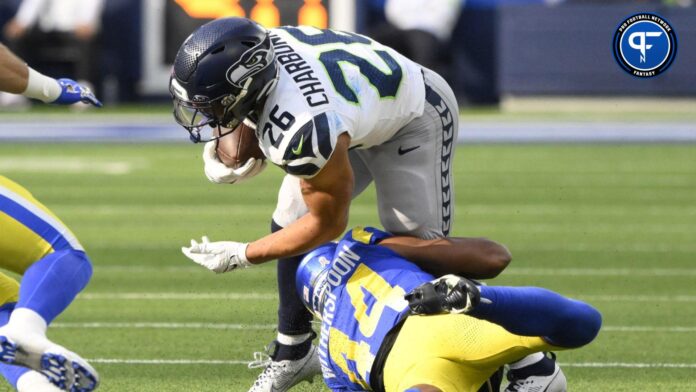 Los Angeles Rams running back Royce Freeman (24) tackles Seattle Seahawks running back Zach Charbonnet (26) in the second quarter at SoFi Stadium.
