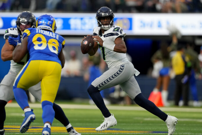 Seattle Seahawks quarterback Geno Smith (7) looks to pass against the Los Angeles Rams in the second quarter at SoFi Stadium.