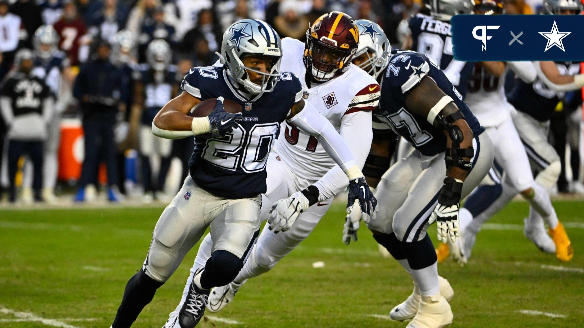 Dallas Cowboys running back Tony Pollard (20) carries the ball against the Washington Commanders during the first half at FedExField.