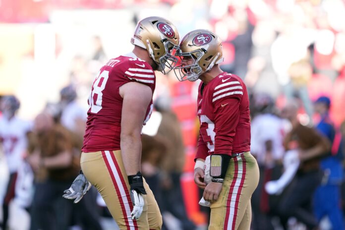 Brock Purdy (right) celebrates with offensive tackle Colton McKivitz (left) after throwing a touchdown pass during the third quarter against the Tampa Bay Buccaneers at Levi's Stadium.