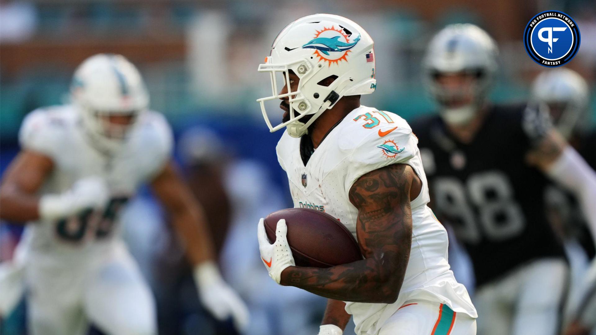 Miami Dolphins running back Raheem Mostert (31) runs with the ball against the Las Vegas Raiders during the first half at Hard Rock Stadium.