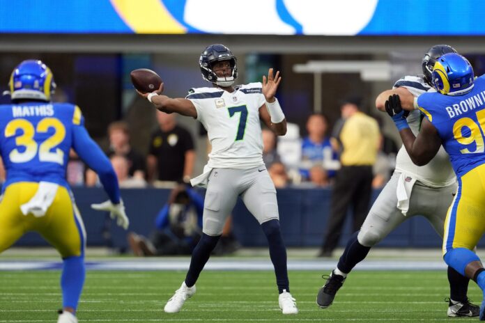 Seattle Seahawks quarterback Geno Smith (7) passes against the Los Angeles Rams in the second quarter at SoFi Stadium.