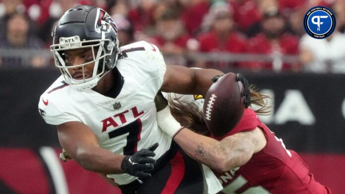Arizona Cardinals linebacker Dennis Gardeck (45) pushes Atlanta Falcons running back Bijan Robinson (7) out of bounds