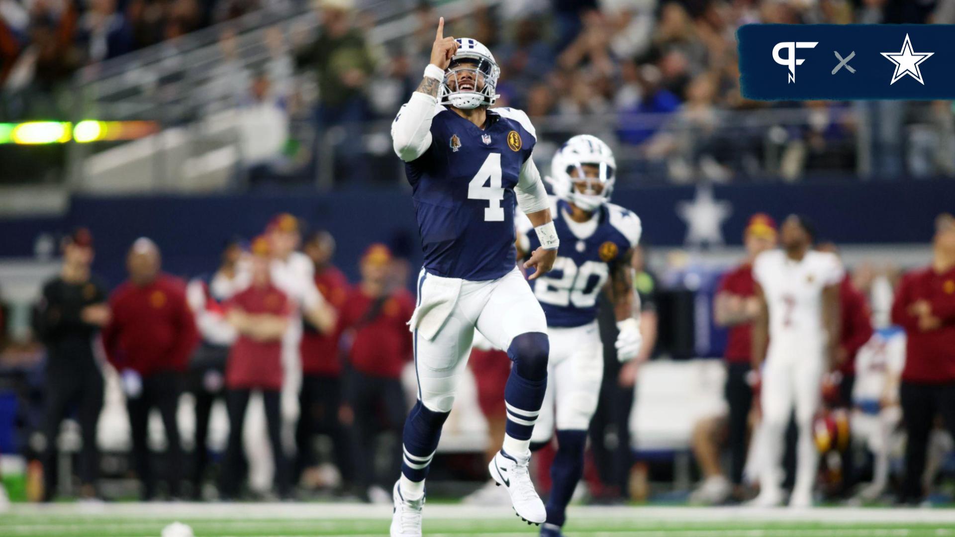 Dallas Cowboys quarterback Dak Prescott (4) celebrates throwing a touchdown in the fourth quarter against the Washington Commanders at AT&T Stadium.