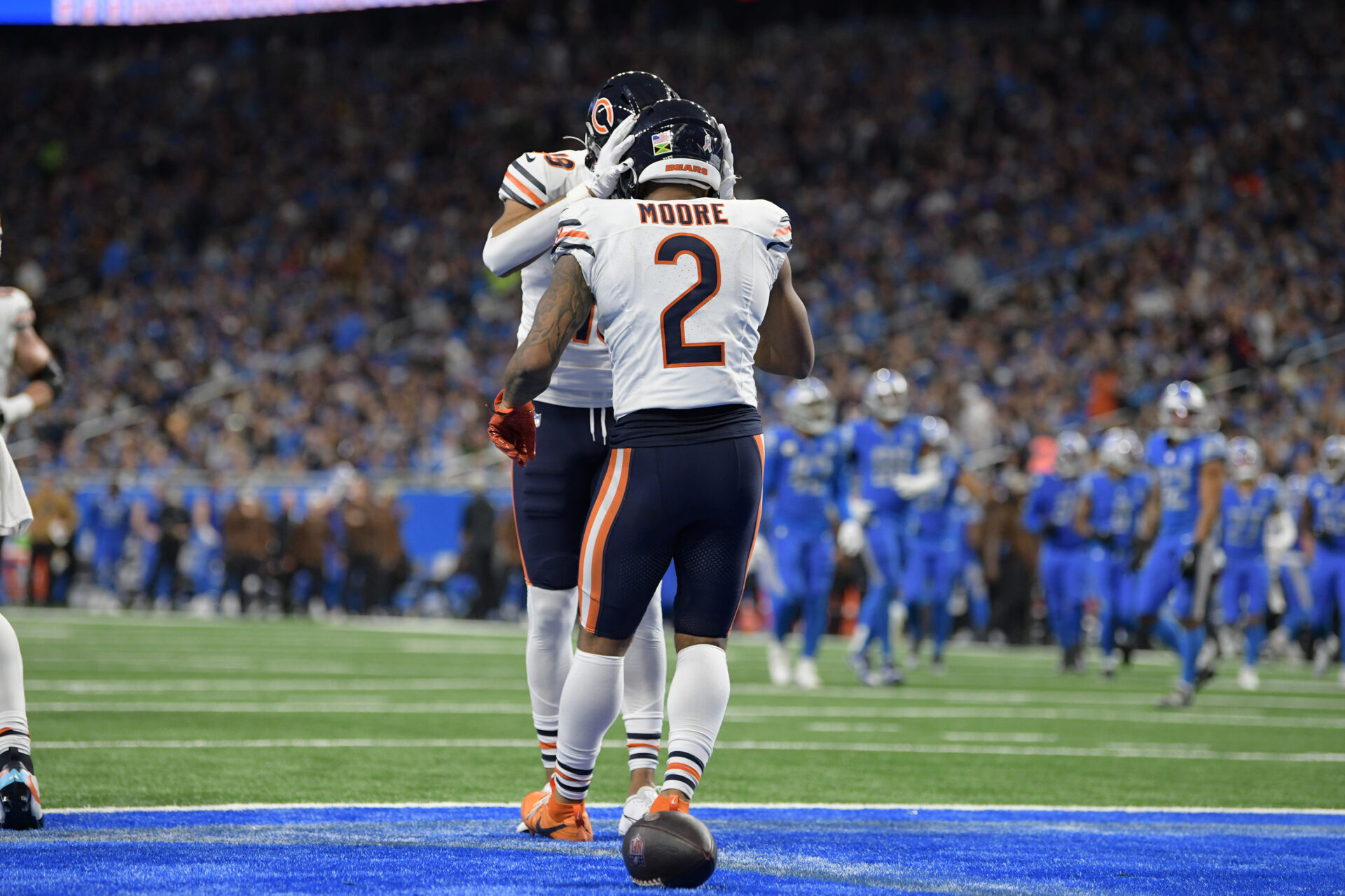 Chicago Bears wide receiver DJ Moore (2) celebrates with a teammate after catching a pass for a touchdown against the Detroit Lions in the third quarter at Ford Field.