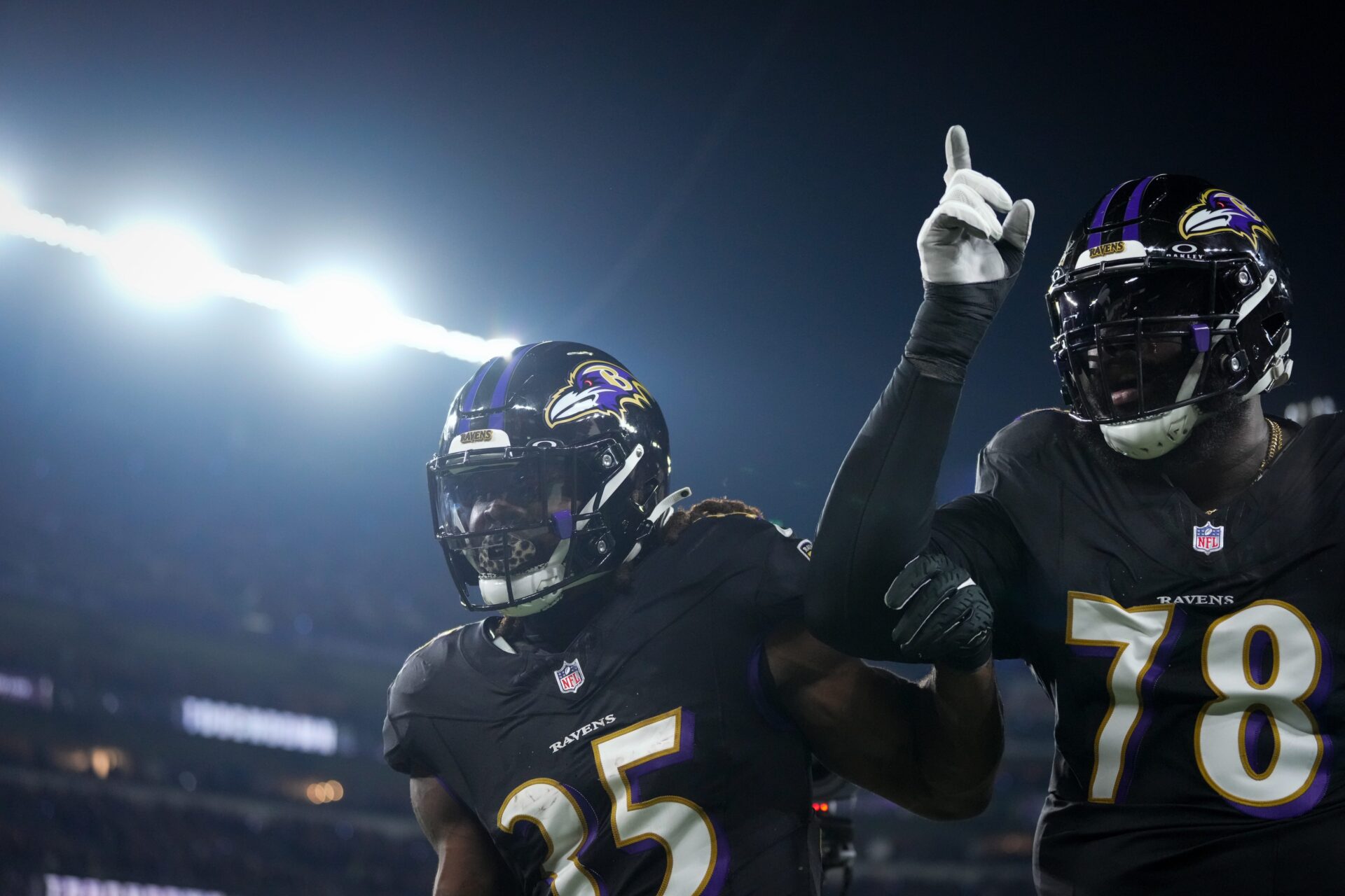 Baltimore Ravens running back Gus Edwards (35) celebrates a touchdown run with offensive tackle Morgan Moses (78).