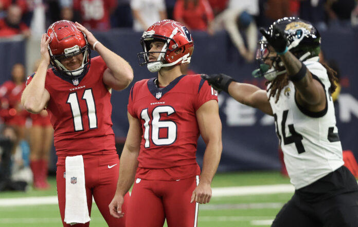 Houston Texans punter and place holder Cameron Johnston (11) reacts after Houston Texans place kicker Matt Ammendola (16) missed a 57-yard field goal against the Jacksonville Jaguars late in the fourth quarter at NRG Stadium.