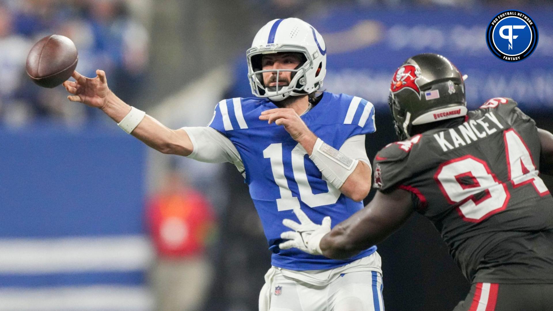 Indianapolis Colts quarterback Gardner Minshew II (10) fires off a pass as Tampa Bay Buccaneers defensive tackle Calijah Kancey (94) closes in Sunday, Nov. 26, 2023, during a game against the Tampa Bay Buccaneers at Lucas Oil Stadium in Indianapolis.