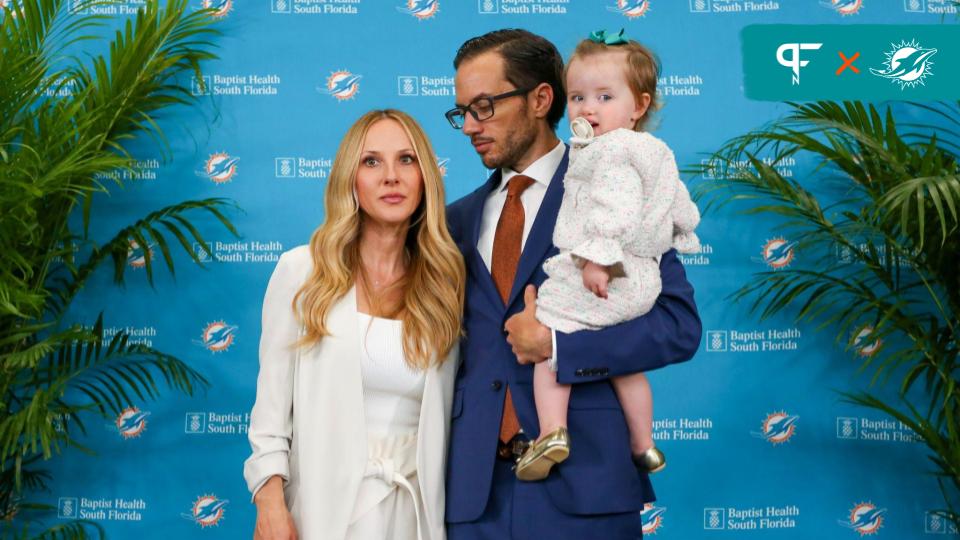 Miami Dolphins head coach Mike McDaniel is photographed with his wife Katie and their daughter Ayla during a press conference at Baptist Health Training Center.