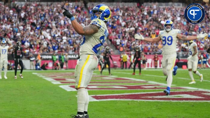 Los Angeles Rams running back Kyren Williams (23) celebrates a touchdown pass catch the Arizona Cardinals during the second half at State Farm Stadium.
