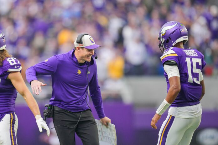 Minnesota Vikings head coach Kevin O'Connell celebrates with quarterback Joshua Dobbs (15) after a touchdown against the New Orleans Saints.
