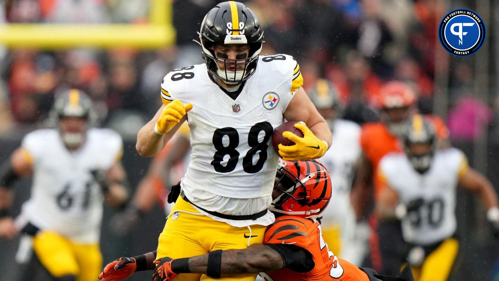 Pittsburgh Steelers tight end Pat Freiermuth (88) is tackled by Cincinnati Bengals safety Nick Scott (33) after a catch a in the first quarter at Paycor Stadium.
