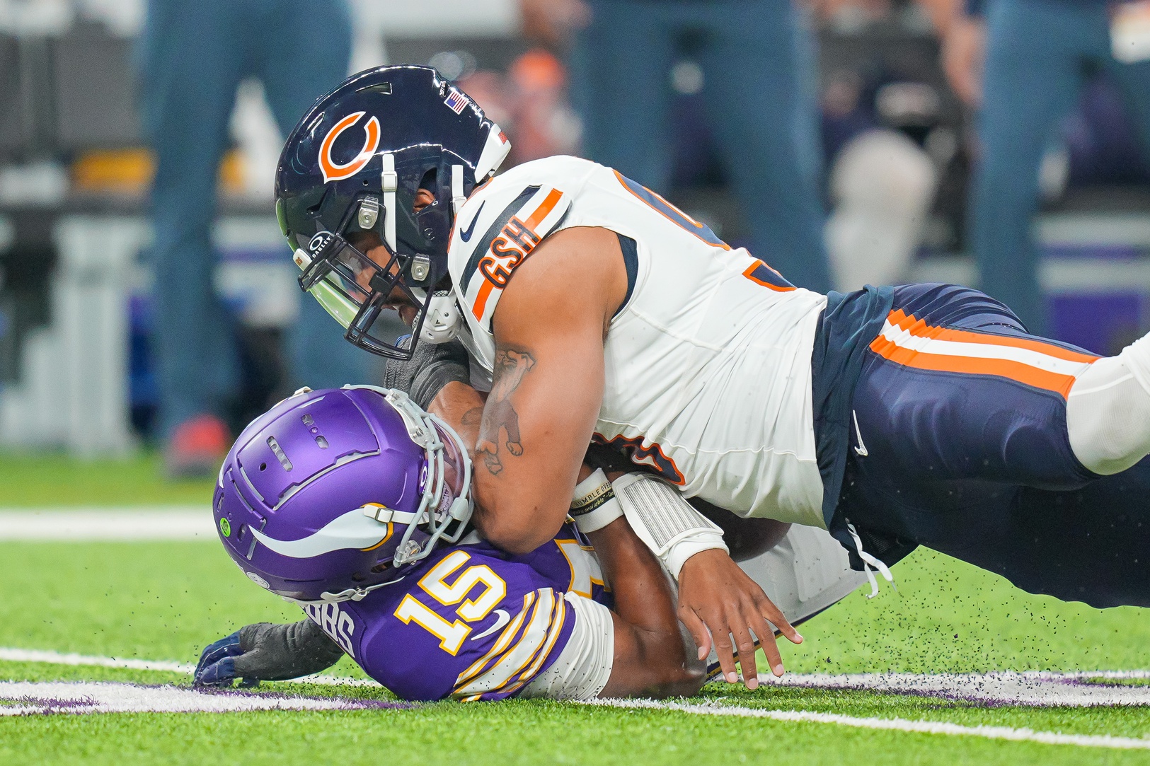 Chicago Bears defensive end Montez Sweat (98) sacks Minnesota Vikings quarterback Joshua Dobbs (15) in the first quarter at U.S. Bank Stadium.