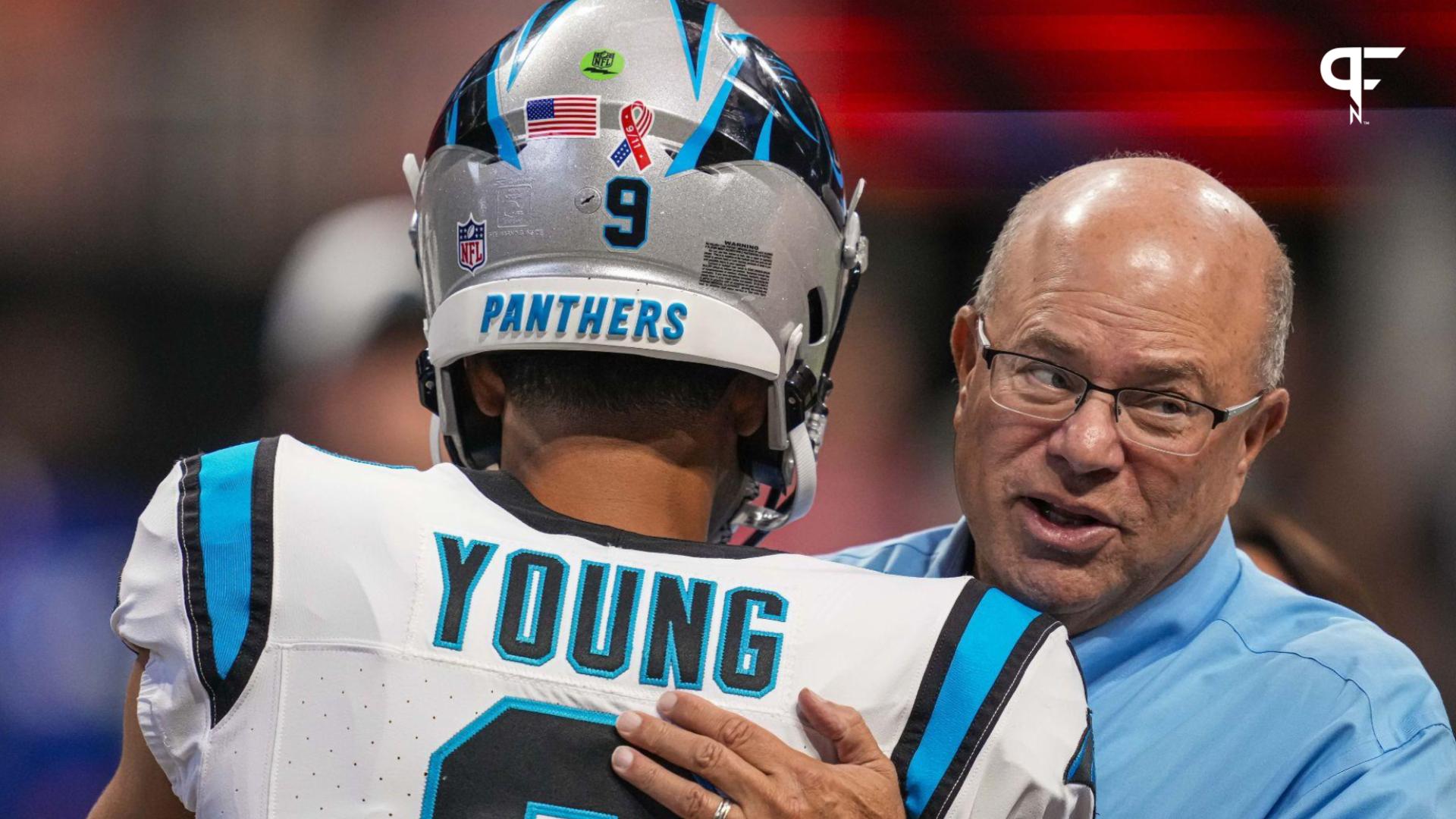 Carolina Panthers quarterback Bryce Young (9) hugs team owner David Tepper on the field prior to the game against the Atlanta Falcons at Mercedes-Benz Stadium.
