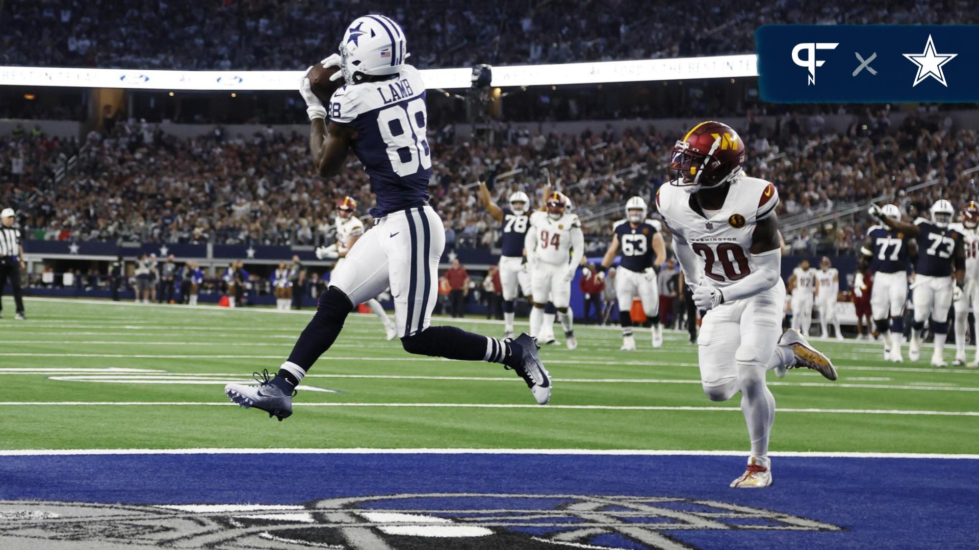 Dallas Cowboys wide receiver CeeDee Lamb (88) catches a touchdown pass against Washington Commanders safety Jartavius Martin (20) in the fourth quarter at AT&T Stadium.