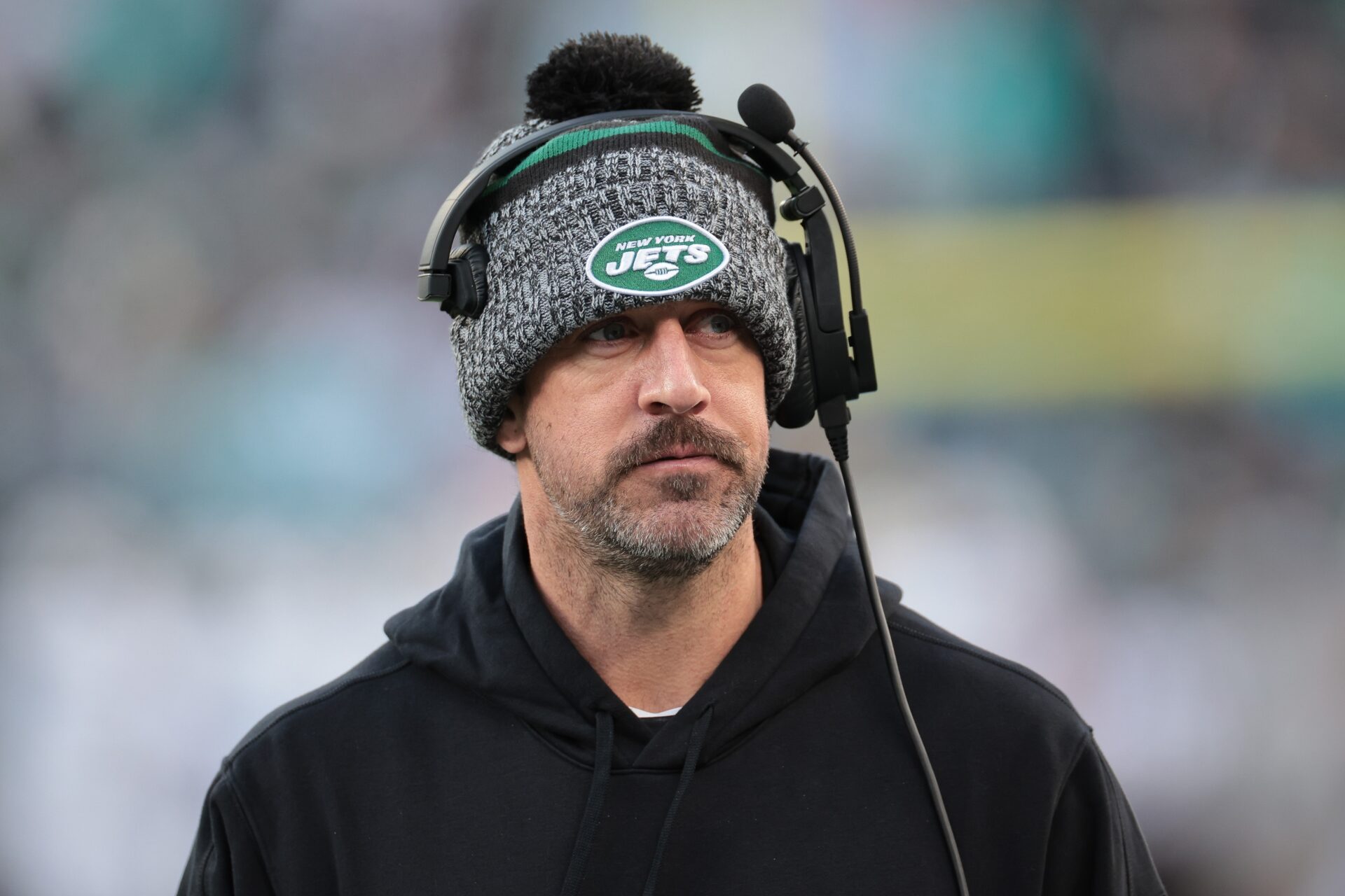 New York Jets QB Aaron Rodgers on the sidelines during the team's game against the Miami Dolphins.