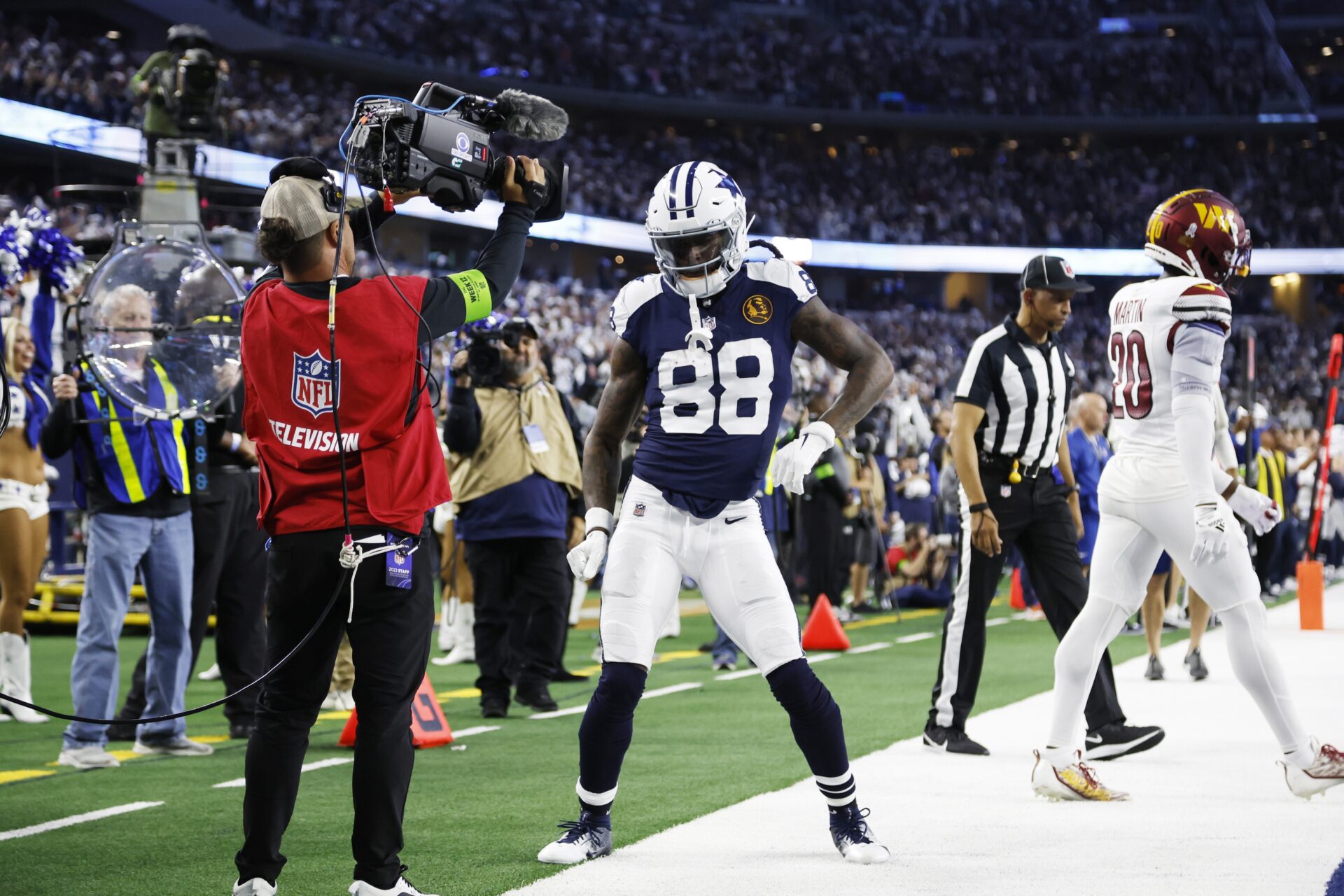 Dallas Cowboys wide receiver CeeDee Lamb (88) celebrates scoring a touchdown in the fourth quarter against the Washington Commanders at AT&T Stadium.