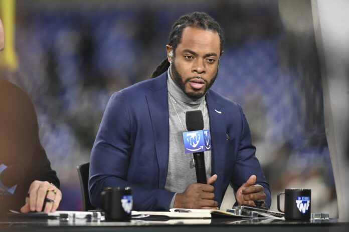 Richard Sherman, Thursday Night Football analyst, on set before the game between the Baltimore Ravens and the Cincinnati Bengals at M&T Bank Stadium.