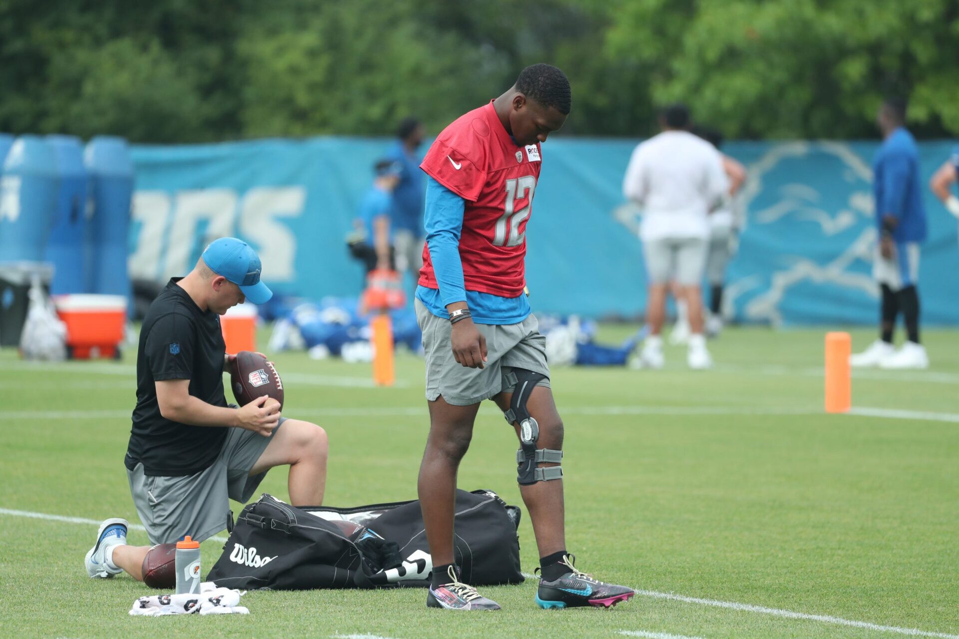 Detroit Lions quarterback Hendon Hooker (12) prepares to workout after training camp at team headquarters in Allen Park on Friday, July 28, 2023.