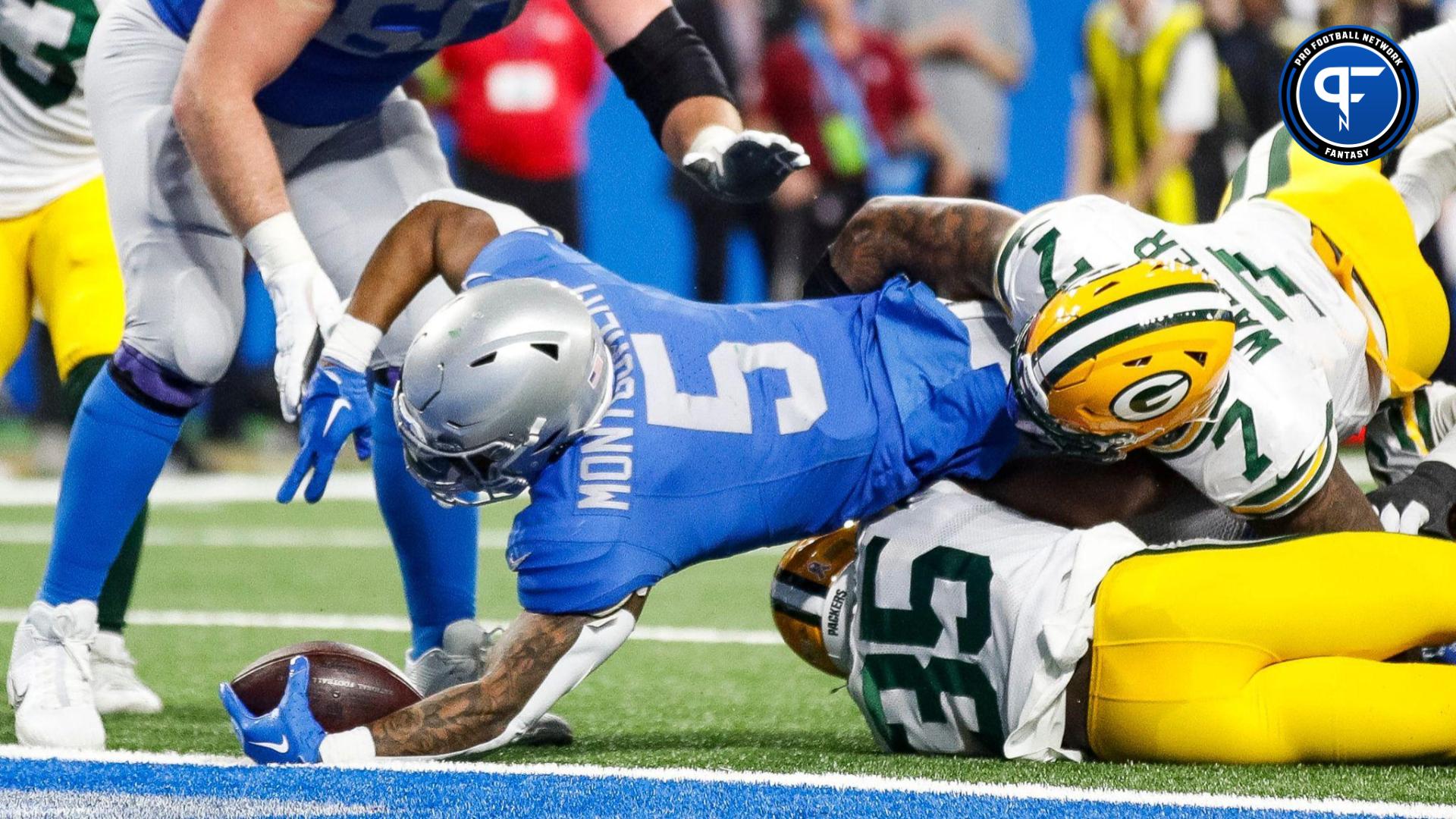 Detroit Lions running back David Montgomery (5) runs a touchdown against the Green Bay Packers during the second half at Ford Field in Detroit on Thursday, Nov. 23, 2023.