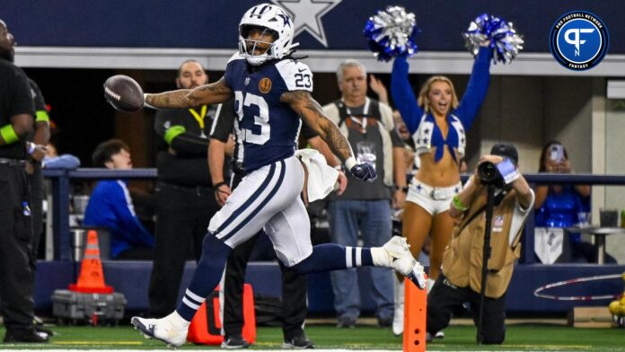 Dallas Cowboys running back Rico Dowdle (23) scores a touchdown against the Washington Commanders.