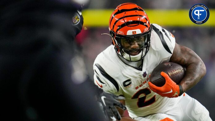 Cincinnati Bengals running back Joe Mixon (28) leans into a tackle on a run in the second quarter of the NFL Week 11 game between the Baltimore Ravens and the Cincinnati Bengals at M&T Bank Stadium in Baltimore.